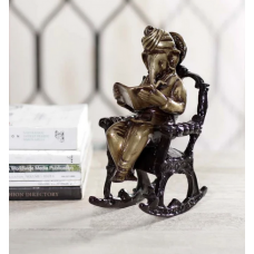 Brown Brass Lord Ganesha Idol On Rocking Chair Showpiece